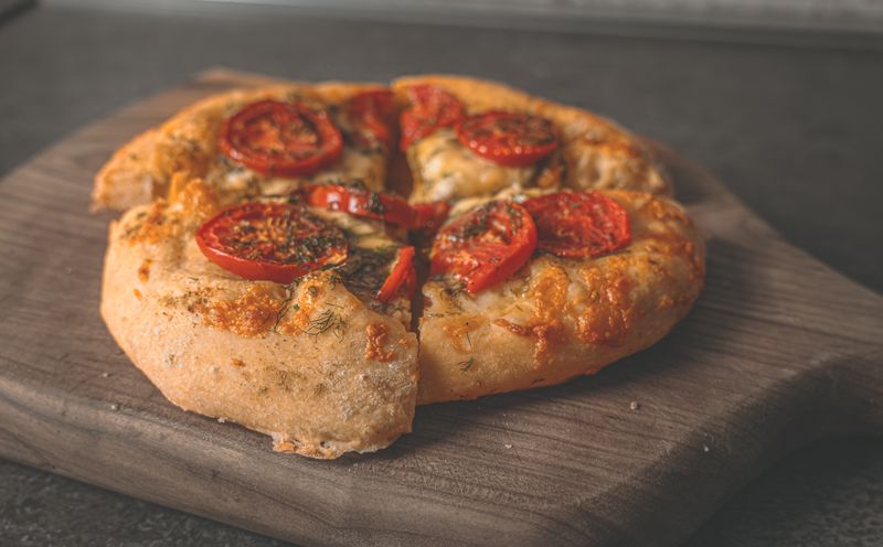Four cheese deep dish pizza with golden crust