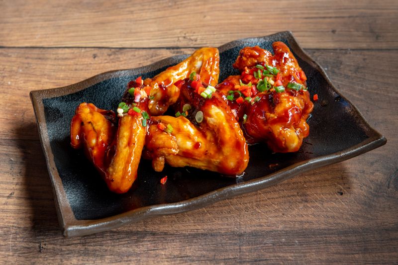 Honey BBQ glazed wings with sesame seeds