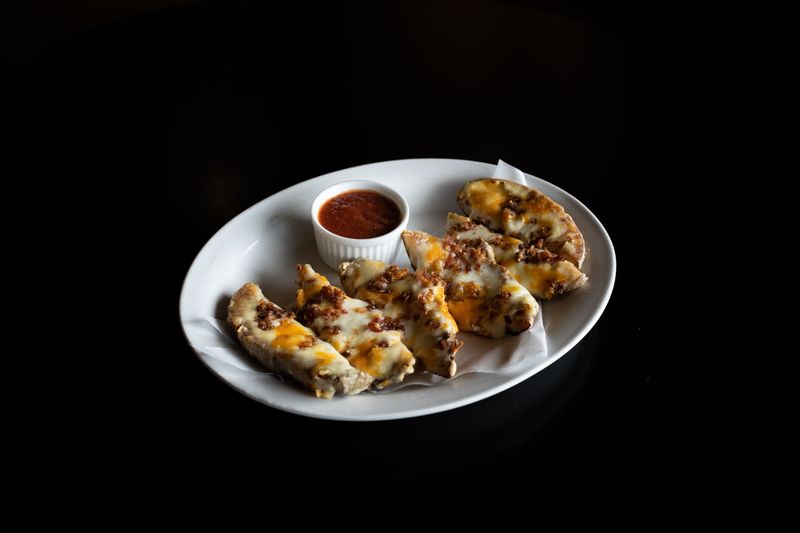 Cheesy garlic bread sticks served hot