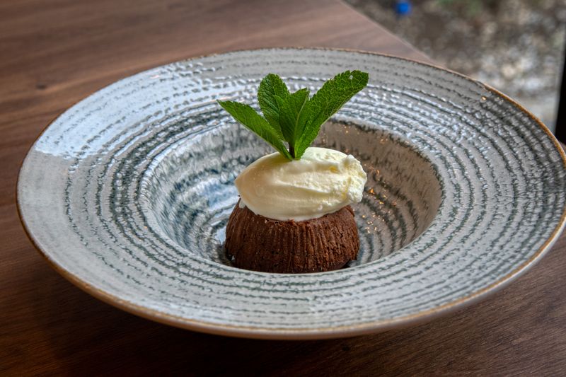 Warm chocolate brownie dessert with ice cream