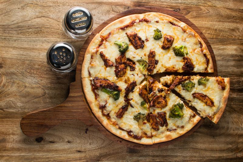 BBQ Chicken pizza with smoked chicken and red onion