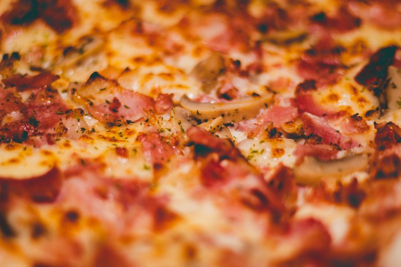 Sausage deep dish pizza baked golden brown